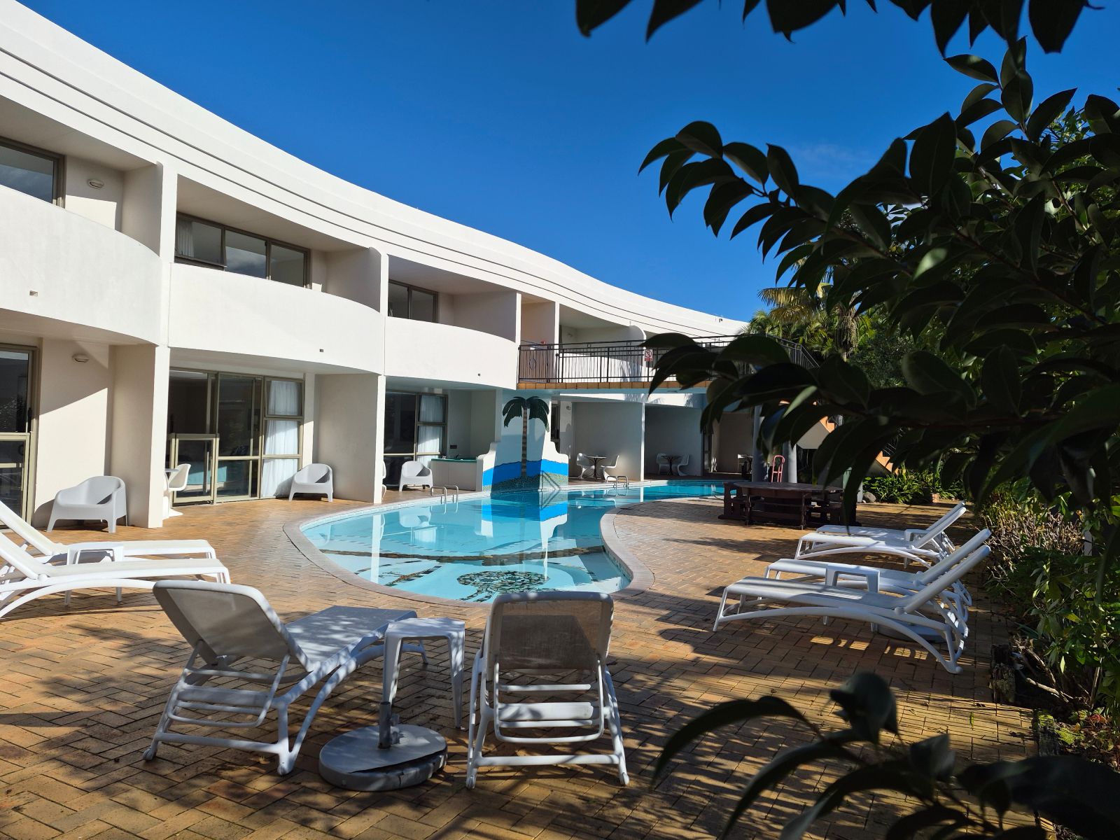 Breakers Motel has a swimming pool and BBQ area